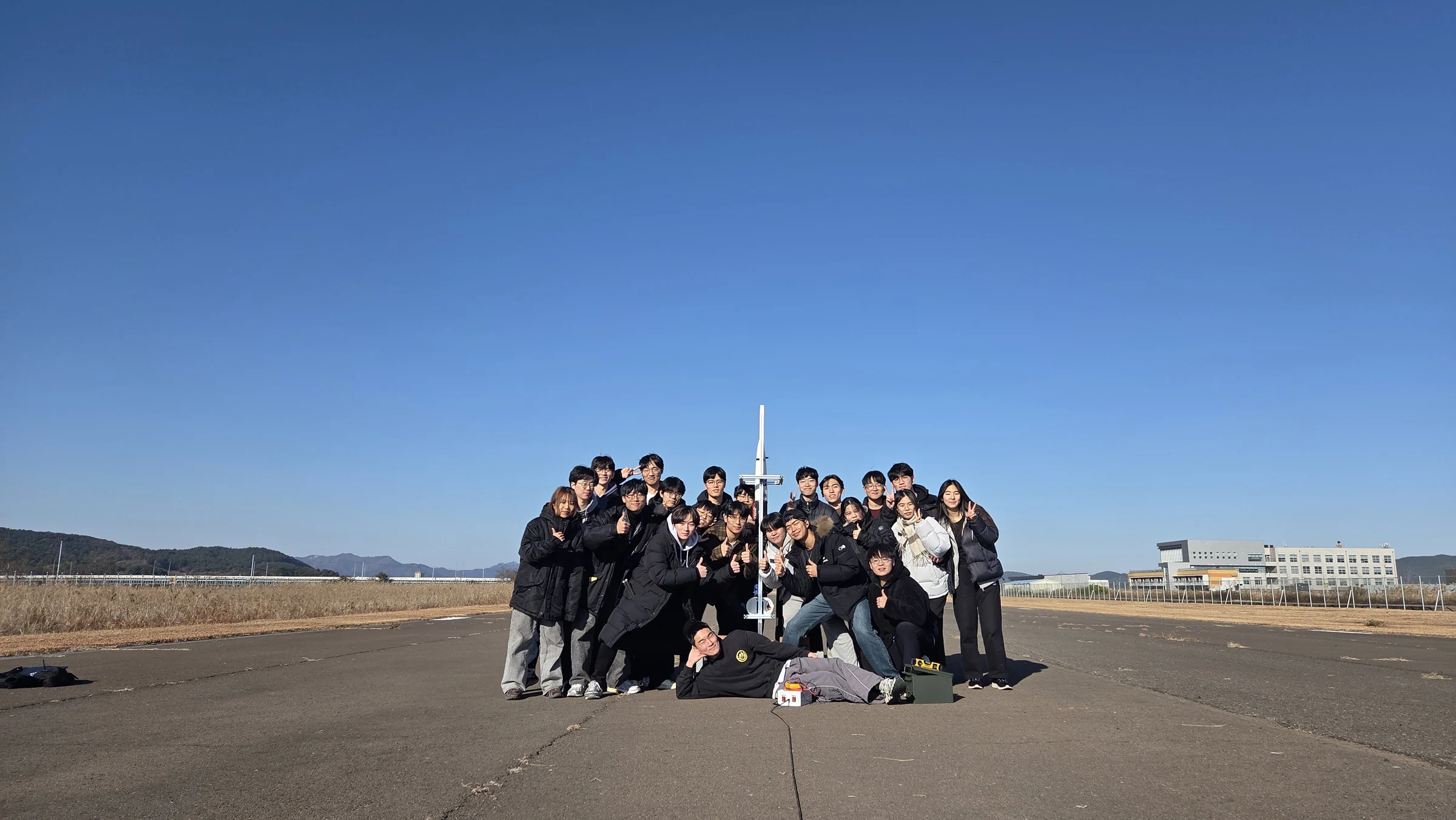 PSI members and their rocket at the launch field